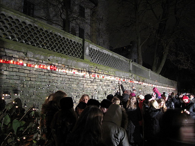 Lighting candles at Riga Castle