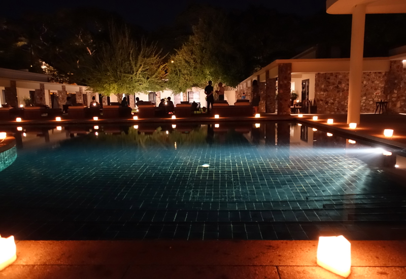 Amansara Pool Lit by Candlelight at Night