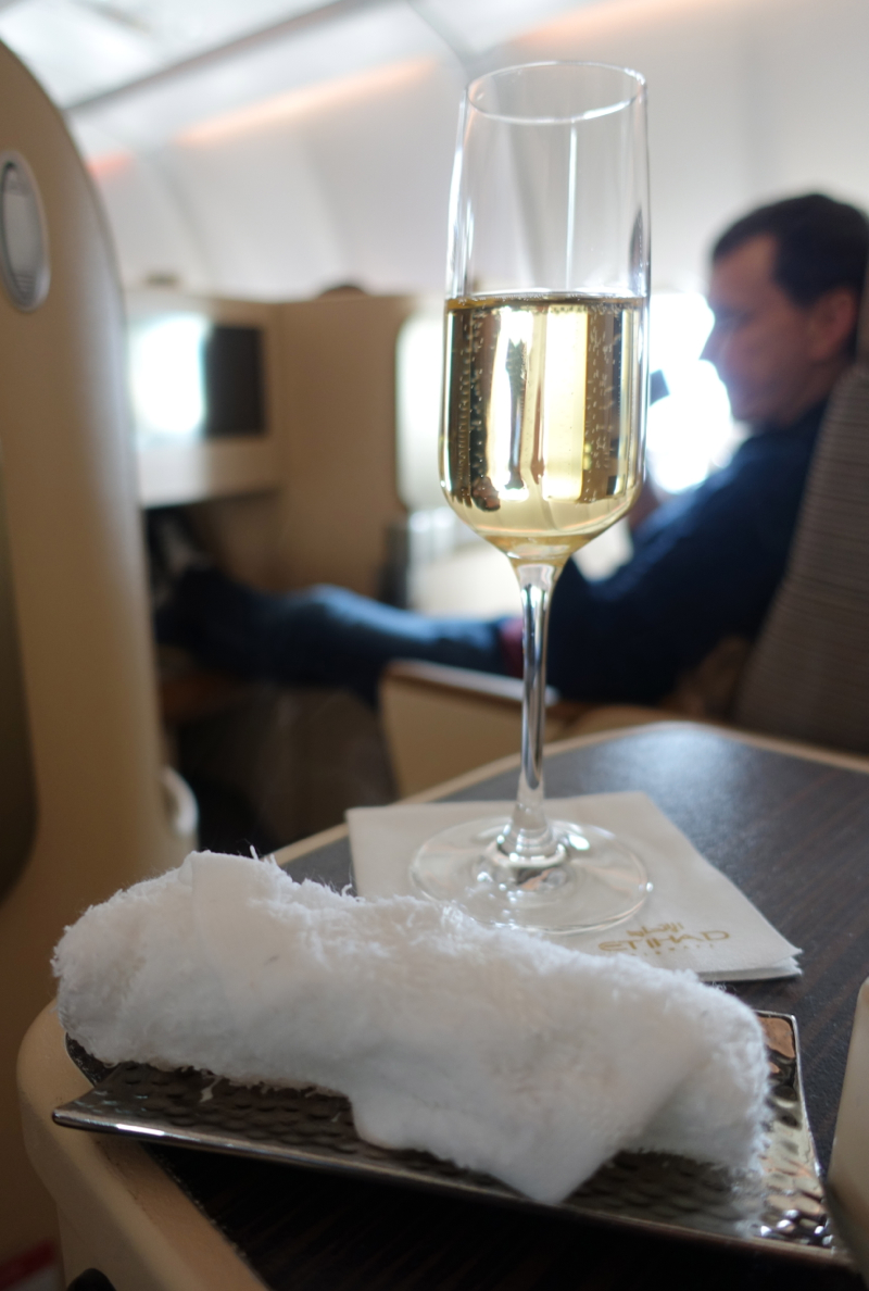 Etihad Business Class Review-Refreshing Towel and Pre-Flight Drink-Champagne