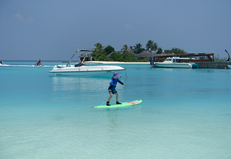 Surfing in the Maldives at Four Seasons Kuda Huraa