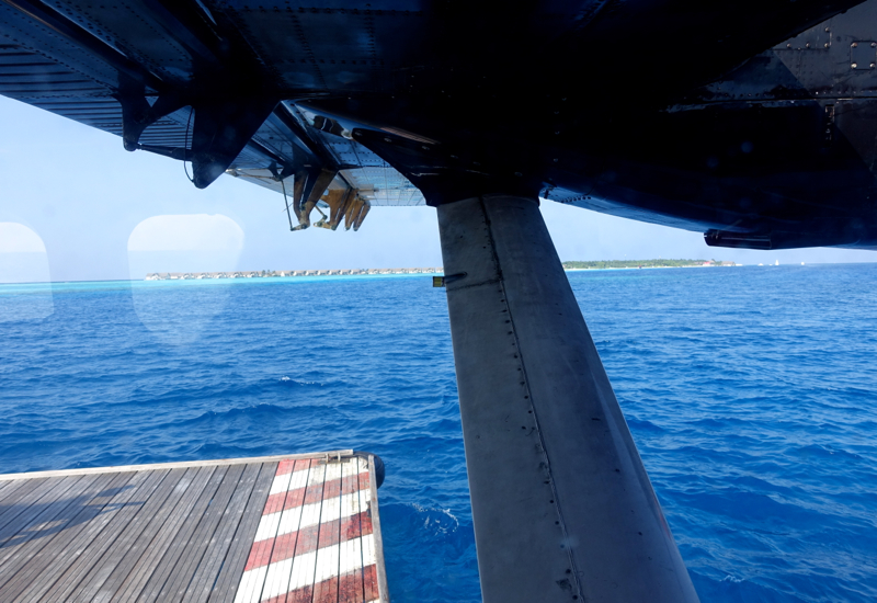 Trans Maldivian Seaplane Approaching a Buoy