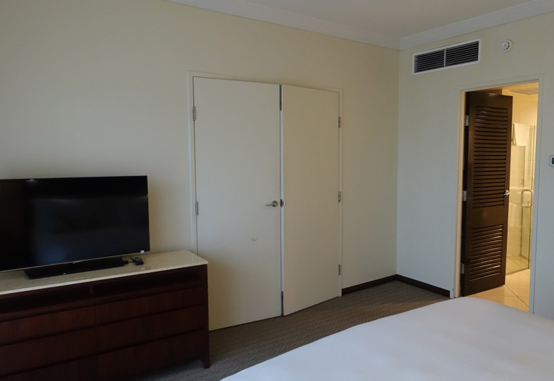 Sofitel Fiji Opera Suite Review: Wooden Doors Separate Bedroom from Living Room