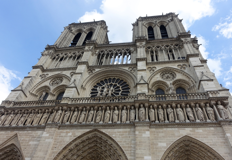Looking Up at Notre Dame's Western Facade Before Entering