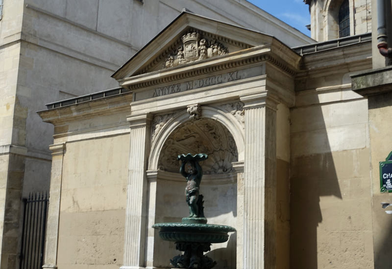 Figuring Out the Roman Numerals on a Marais Fountain, Paris Muse Walk Review