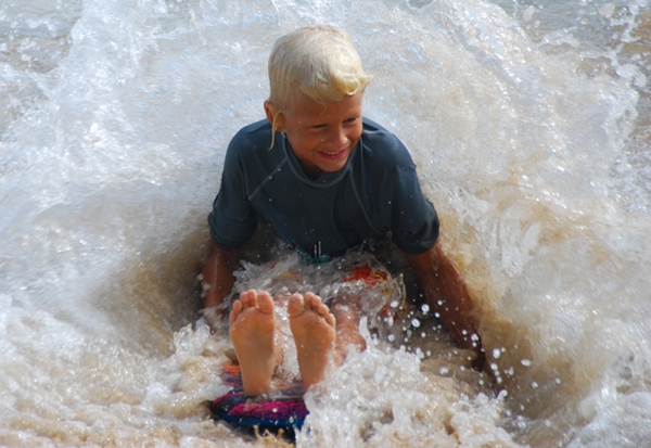 Kid playing in the water, Waikiki Beach, Hawaii