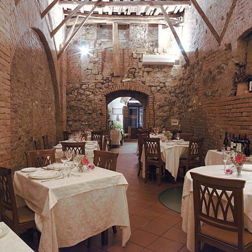 The stunning dining hall at Antica Osteria da Divo, Siena