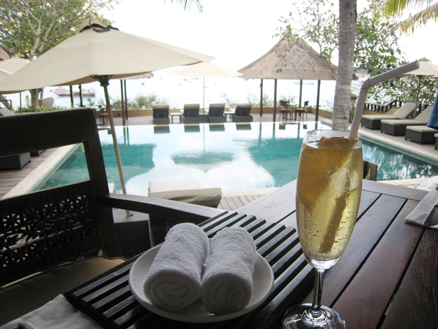 Batu Karang Review - Welcome drink and towel by pool