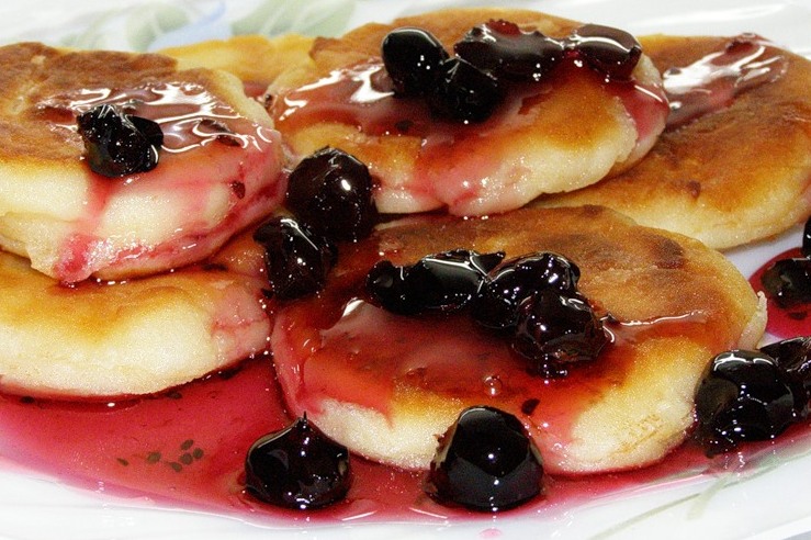 Syrniki with cherry sauce, Russia